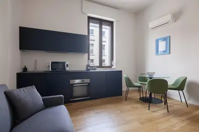 a living room with a couch and a table at Ninni's House by DomuSicily in Palermo
