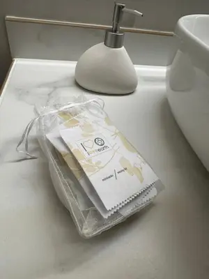 a package of toilet paper sitting on a bathroom counter at Kanisa Mari e Monti in Cinisi