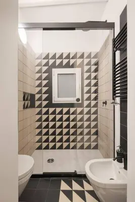 a bathroom with a toilet and a sink at The Garden Boutique Apartment by DomuSicily in Palermo