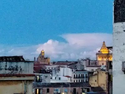 a view of a city skyline at night at Cattedrale - VISTA HOUSE easy parking in Palermo