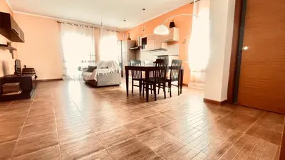 a kitchen and dining room with a table and chairs at Proserpina House in Palermo
