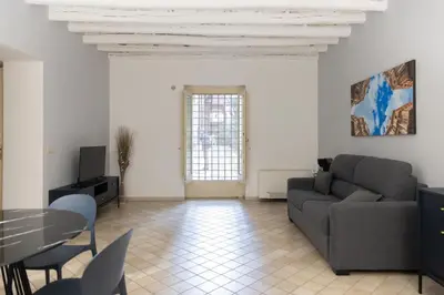 a living room with a couch and a table at Dimora Artale in Cattedrale in Palermo