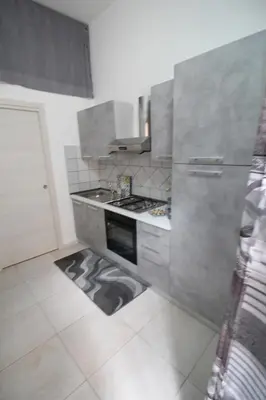 a kitchen with a stove and an oven at Case Billeci Casa blu in Palermo