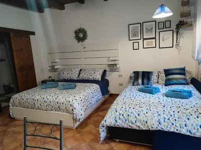 two beds sitting next to each other in a bedroom at Palermo Al Capo in Palermo