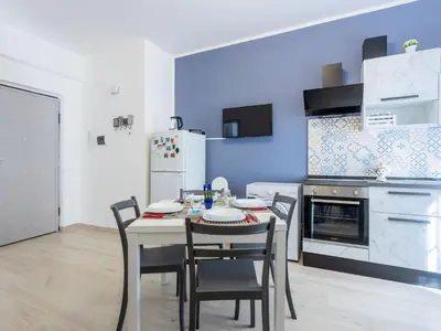 a dining room with a table and chairs in a kitchen at Apartment La Casetta di Clò by Interhome in Palermo
