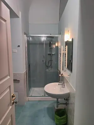 a bathroom with a shower and a sink at B&B Palazzo Corvino in Palermo