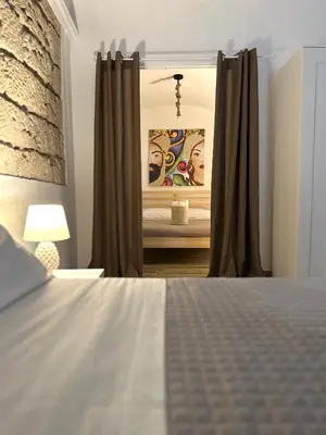 a bedroom with a bed and a mirror at Il Moro in Carini