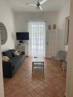 a living room with a couch and a coffee table at The k house in Palermo