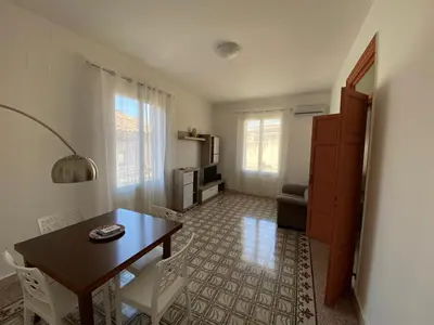 a living room with a dining room table and chairs at Al Parlatoio del Centro Storico in Palermo