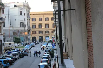 a view of a street with cars parked on the sidewalk at LA VECCHIA PALERMO in Palermo