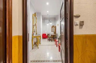 a hallway leading to a room with a dining room at LA VECCHIA PALERMO in Palermo