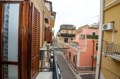 a view of an alley from a balcony at La Dimora di David in Bagheria
