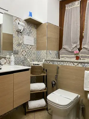a bathroom with a toilet and a sink at La Dimora di David in Bagheria