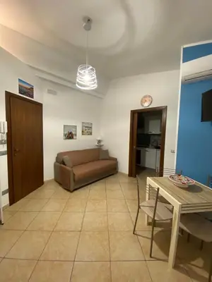 a living room with a couch and a table at La Dimora di David in Bagheria