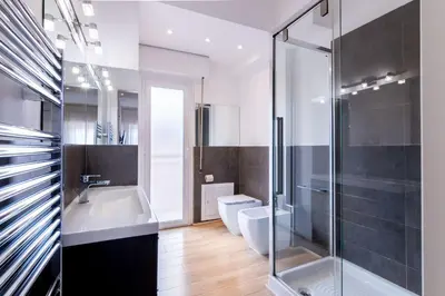 a bathroom with a toilet and a sink and a shower at Eye on the Politeama - L'occhio sul Politeama in Palermo