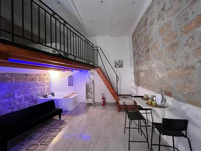 a bathroom with a bath tub and a sink at La casetta nel vicolo in Palermo