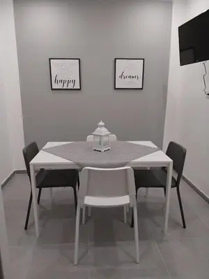 a white table and chairs in a room at Amunì o 123 in Palermo
