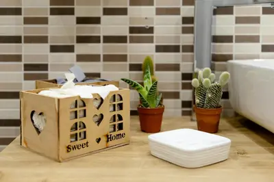 a small cardboard house on a counter in a bathroom at [The historical center of Palermo] La Dolce Vita in Palermo