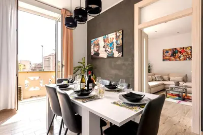 a dining room with a white table and chairs at [The historical center of Palermo] La Dolce Vita in Palermo