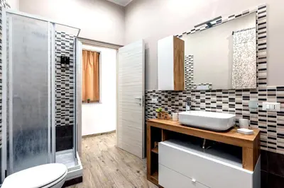 a bathroom with a sink and a shower at [The historical center of Palermo] La Dolce Vita in Palermo