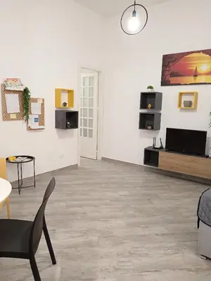 a large white room with a table and chairs at Sea sicily home in Santa Flavia