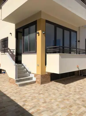 a building with a balcony and stairs on it at Casa Narciso - Mondello in Mondello