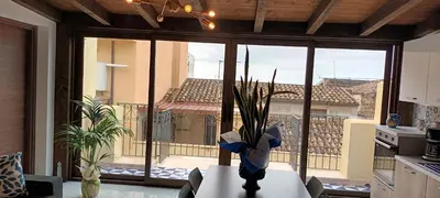 a vase with a plant on a table in a kitchen at Palazzo DS in Castellammare del Golfo