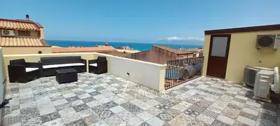 a view of a patio with a view of the ocean at Palazzo DS in Castellammare del Golfo