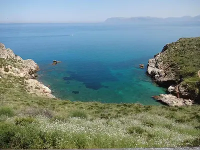 a view of a body of water from a hill at Appartamenti Cala Rossa (Antonella) in Castellammare del Golfo