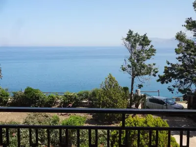 a view of the ocean from a balcony at Appartamenti Cala Rossa (Antonella) in Castellammare del Golfo