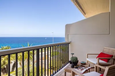 a balcony with a view of the ocean at Sole di Giada by DomuSicily in Mondello