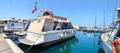 a boat docked in a marina with other boats at Panaby - House Boat in Palermo