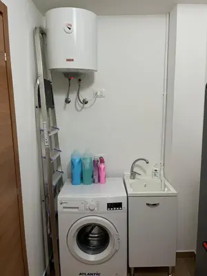 a washing machine and a sink in a room at Casa Corbezzolo in Balestrate