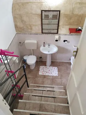 a bathroom with a sink and a toilet at B&B Sikelia in Terrasini