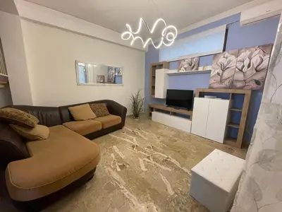 a living room with a couch and a tv at Dai Maestri Rubino in Vita