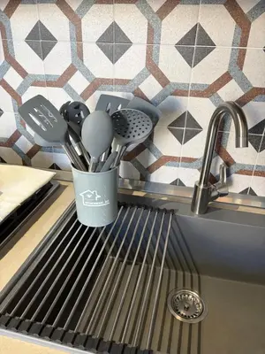 a kitchen counter with a counter top with a counter top at Elisir house in Palermo