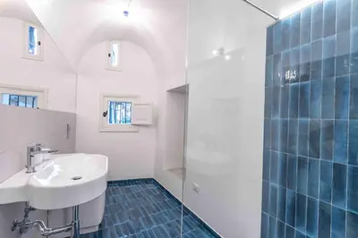 a bathroom with a sink and a shower at Calderai 82 suites 1 e 2 in Palermo