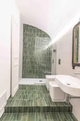 a bathroom with a sink and a tub and a toilet at Calderai 82 suites 1 e 2 in Palermo