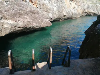 a stairway leading into a body of water at Casa Tequi a 200mt dal mare in Terrasini