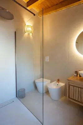 a bathroom with a shower and a toilet and a sink at Le Terrazze dei Candelai 