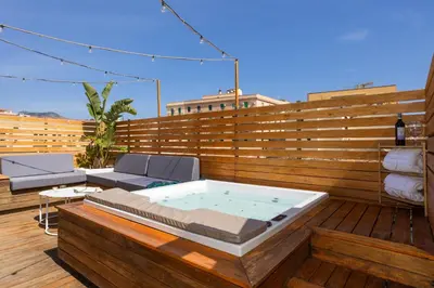 a hot tub sitting on a wooden deck at Le Terrazze dei Candelai 