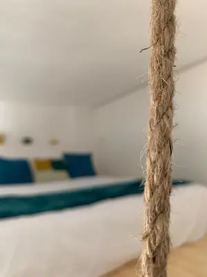 a rope in front of a bed in a room at Curtigghiu Mondello in Mondello