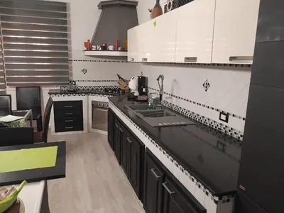 a kitchen with a sink and a counter top at Sea Holiday Orchidea in Palermo