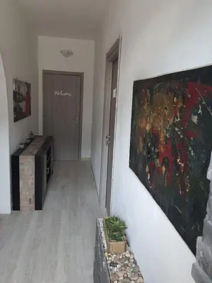 a painting hanging on a wall in a hallway at Sea Holiday Orchidea in Palermo
