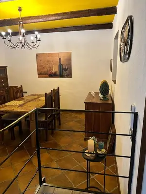 a dining room with a dining table and a dining room at Cut' Home in Monreale