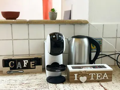 a coffee maker sitting on a counter next to a tea kettle at Cut' Home in Monreale