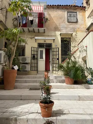 a house with stairs and plants in front of it at Cut' Home in Monreale