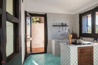 a kitchen with a sink and a counter top at Stunning seaview villa in Altavilla Milicia