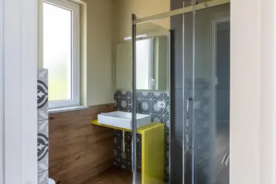 a bathroom with a sink and a shower at Sweet Sicily Apartments in Carini