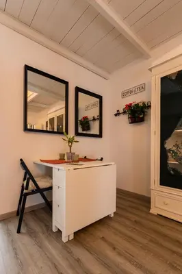 a bathroom with a white vanity and a mirror at ELLY HOLIDAY HOUSE in Palermo